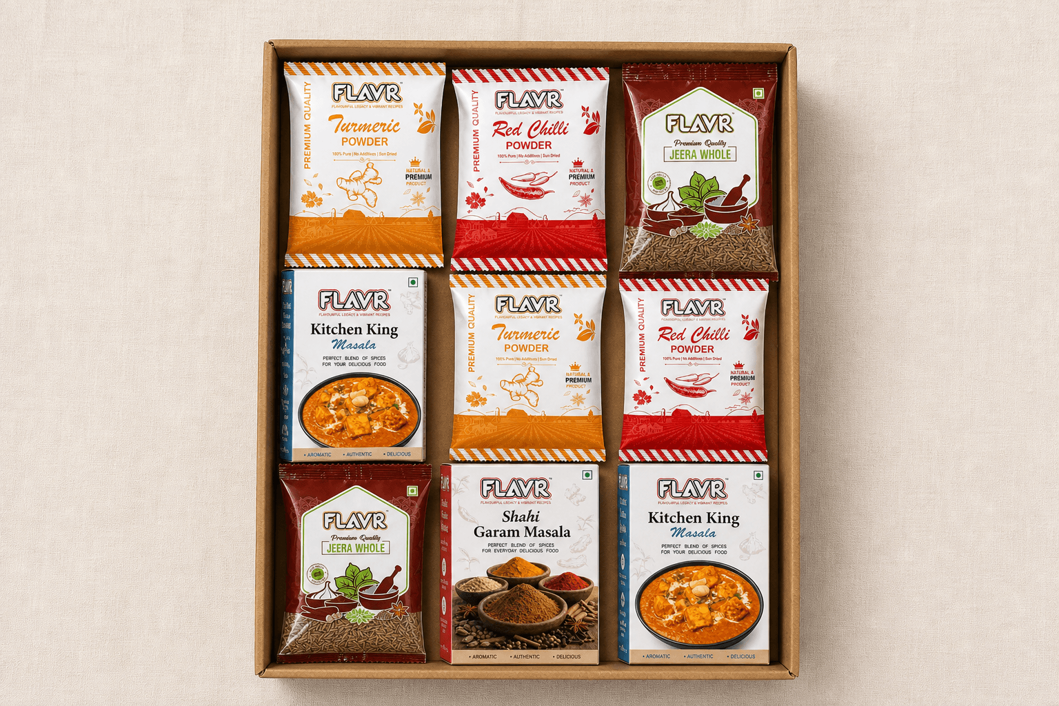 Nine FLAVR spice pouches in a 3×3 grid inside an open family gift box