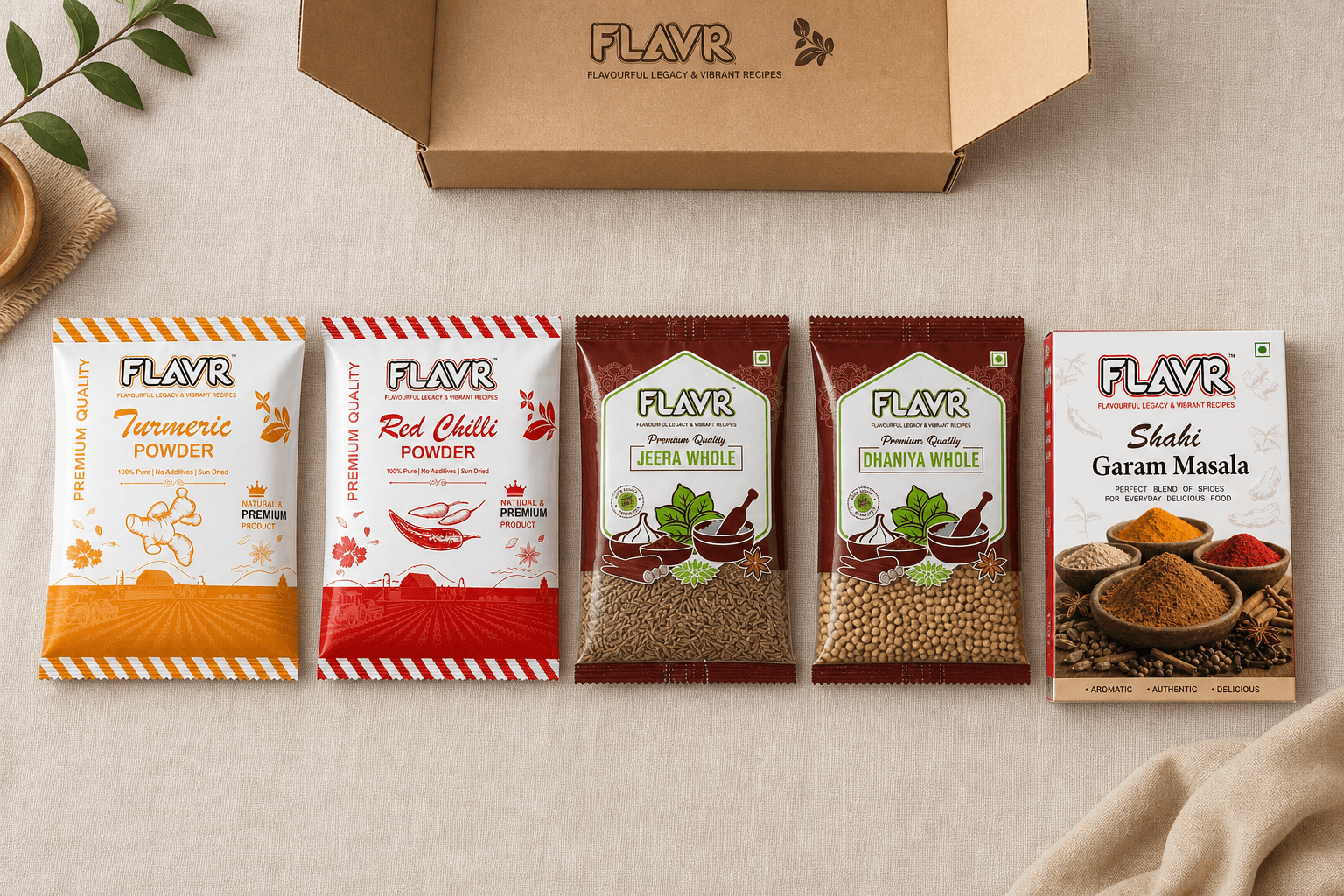 Five FLAVR spice pouches fanned beside an open kraft starter box